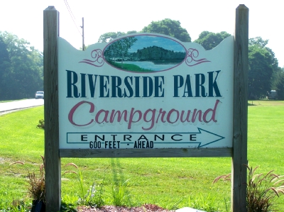 Hand-painted Riverside Park Campground entrance sign along Route 19